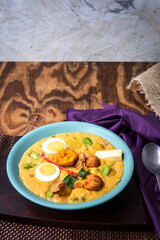 Fanesca dish on a vertical background with copy space