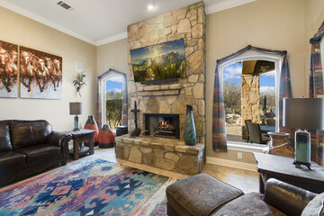 Fototapeta na wymiar Living room with a stone fireplace