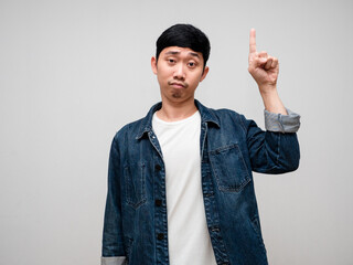 Negative asian man jeans shirt feels confused and doubt gesture point finger isolated