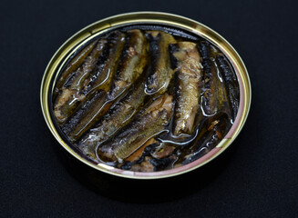 Canned fish in a jar. Sprats in a tin can. Fish in oil.