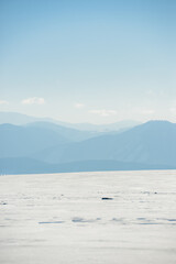 Views from city Liptovsky Mikulas to West Tatras in winter time with snowy trees  and cloudy sky. Liptov region, Slovakia. Winter trees background.