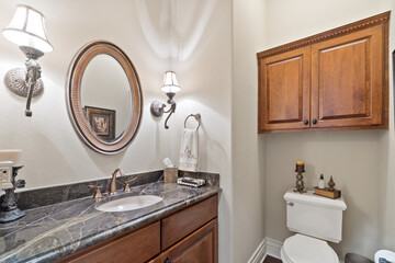 A large master bathroom with white accenting 