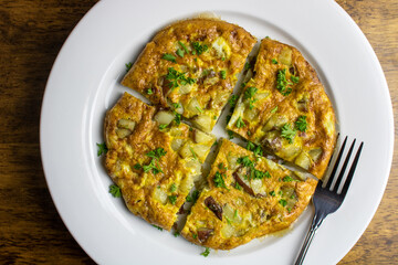 Spanish omelette is a traditional dish from Spain. It is an omelette made with eggs and potatoes, optionally including onions.