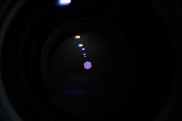 Camera lens with light and lens flare, close-up