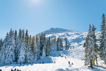 People skiing on a ski slope .Vitosha Mountain ,Bulgaria 