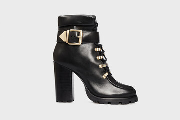 Black blunt toe women's ankle boot with high heel isolated on white background. Female classic,...