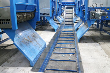 conveyors in the workshop of a waste sorting plant