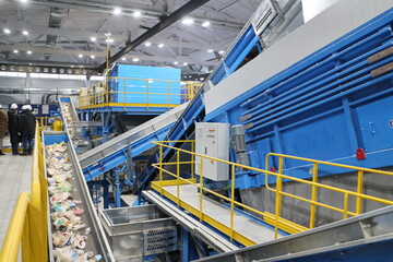 conveyors in the workshop of a waste sorting plant