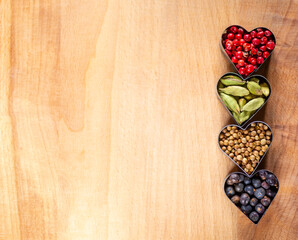 Set of colorful spices on a wooden background. Minimalism. Copy space