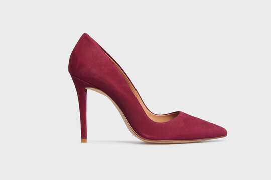 Burgundy pointy toe women's shoe with high heels isolated on white background. Female classic stiletto heels in suede leather. Single. Mock up, template