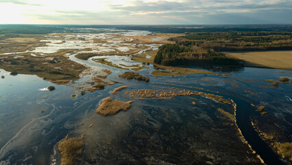 Fototapeta premium Aerial view of the backwaters of the Narew River on a sunny,spring day.