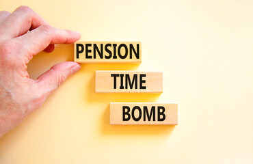 Pension time bomb symbol. Concept words Pension time bomb on wooden blocks on a beautiful white table white background. Businessman hand. Business pension time bomb concept. Copy space.
