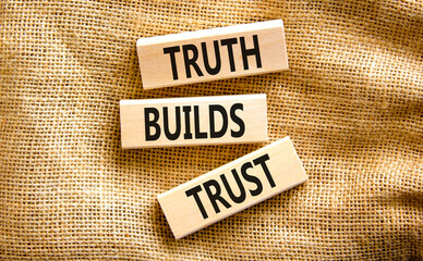 Truth builds trust symbol. Concept words Truth builds trust on wooden blocks on a beautiful canvas table canvas background. Business truth builds trust concept. Copy space.