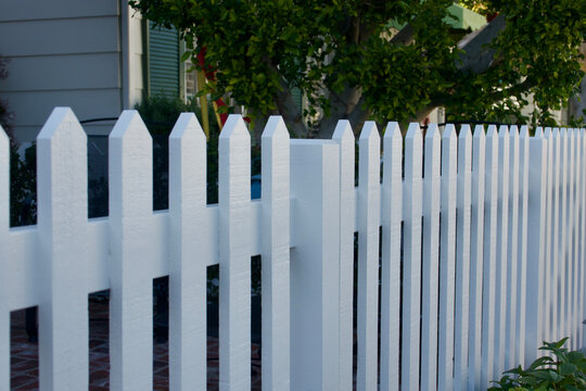 freshly painted classic white picket fence