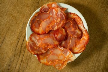 Plate with slices of paio. Paio is a traditional pork sausage from the Alentejo region of Portugal.