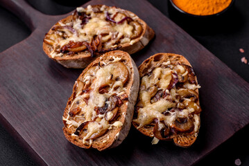 Delicious crispy toast or bruschetta with fried onion, champignon mushrooms and cheese