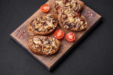 Delicious crispy toast or bruschetta with fried onion, champignon mushrooms and cheese