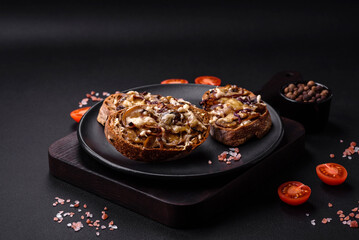 Delicious crispy toast or bruschetta with fried onion, champignon mushrooms and cheese
