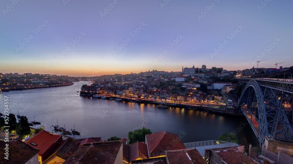 Wall mural panorama old city porto at river duoro, with port transporting boats day to night transition timelap