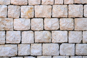 Wall gray stone, decorative material, industrial and construction background, fence, masonry