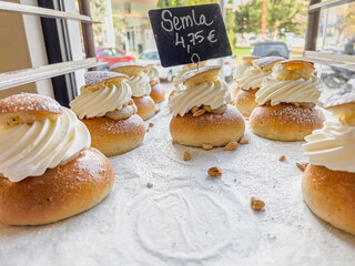 Delicious freshly baked semla or fastlagsbulle or laskiaispulla or vastlakukkel or fastelavnsbolle