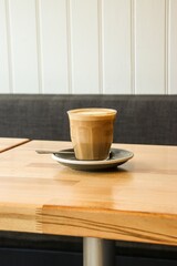 cup of coffee on wooden table