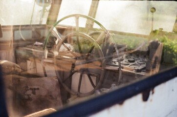 Ship's wheel in an old fishing boat.