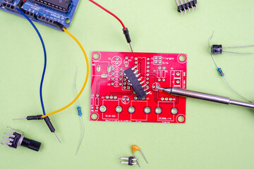 Soldering iron, chips, transistors and electronics parts, printed circuit boards, wires as a concept of electrical work