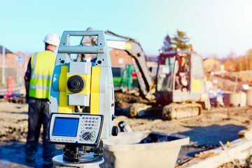 Close-up of surveyor optical equipment  tacheometer or theodolite on construction site with...