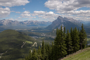  Alpine mountain landscape with snow-capped peaks and coniferous forest in Banff National Park, Alberta, Canada