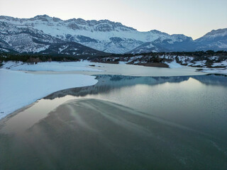 Obraz premium sunset time on frozen lake, wonderful nature and amazing mountains