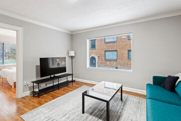modern interior of a white apartment with open floor layout long term rental loft
