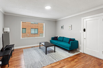 Stylish interior of living room in turquoise color