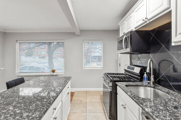 modern interior of a white apartment with open floor layout long term rental loft