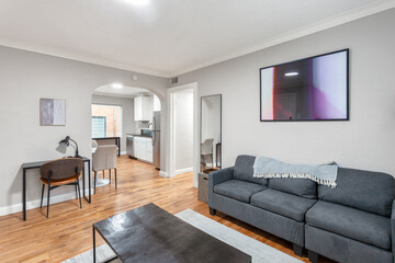 modern interior of a white apartment with open floor layout long term rental loft