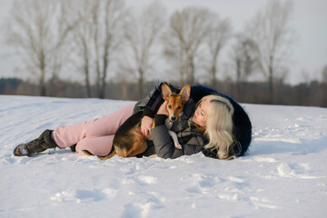 a girl plays with her beloved dog