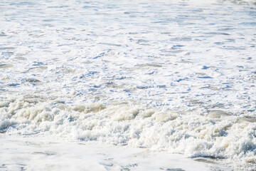Sea foam and ocean wash, salty water at the Pacific Ocean