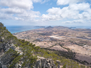 Drone top view from Pico do Castelo at Porto Santo facing the centre of the island - we can see the...