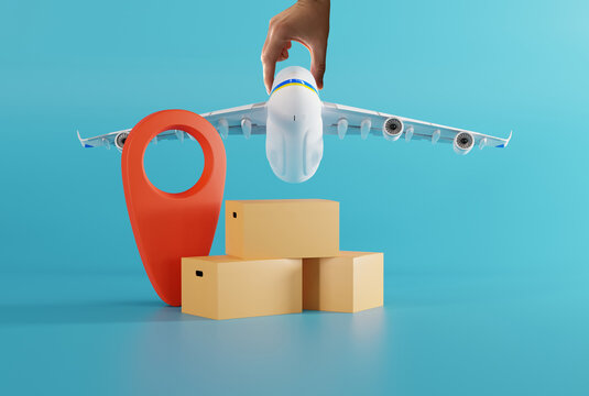A hand holding a plane against the background of cardboard boxes and a geo tag. Parcel delivery concept, couriers and logistics companies. Courier parcels.