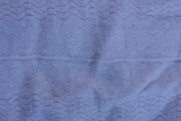 gray cloth texture from a piece of crumpled fabric with a seam