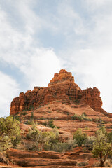 Beautiful Bell Rock at red rock formations in coconino national forest in Sedona Arizona USA against white cloud background. Copy space. Vertical