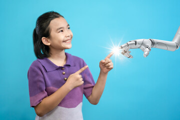 Children touching finger of hand robot on blue background