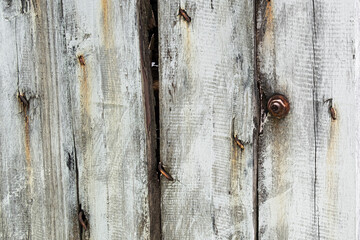 Wood planks with black stains and rusted bolt background texture