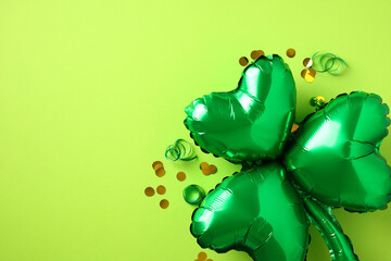 St Patrick Day banner design. Shamrock shaped balloons with confetti on green background.