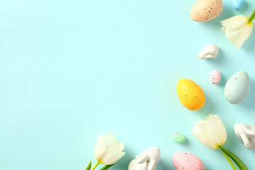 Happy Easter concept. Greeting card template with Easter eggs and spring flowers.