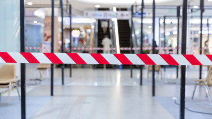Red and White Lines of barrier tape. Striped, red and white tape that forbids passage. Red White warning tape pole fencing is protects for No entry.	