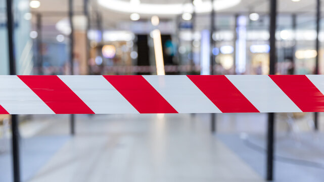 Red and White Lines of barrier tape. Striped, red and white tape that forbids passage. Red White warning tape pole fencing is protects for No entry.	