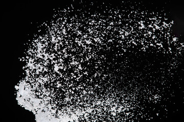 Photo image of falling down snow, heavy big small size snows. Freeze shot on black background isolated overlay. Fluffy White snowflakes splash cloud in mid air. Real Snow high speed shutter