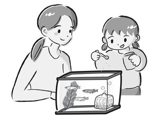 メダカのお世話をする親子（エサやり）