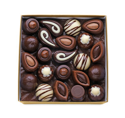 Box of delicious chocolate candies isolated on white, top view